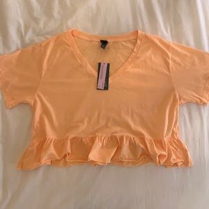 Size Small peach colored T-shirt